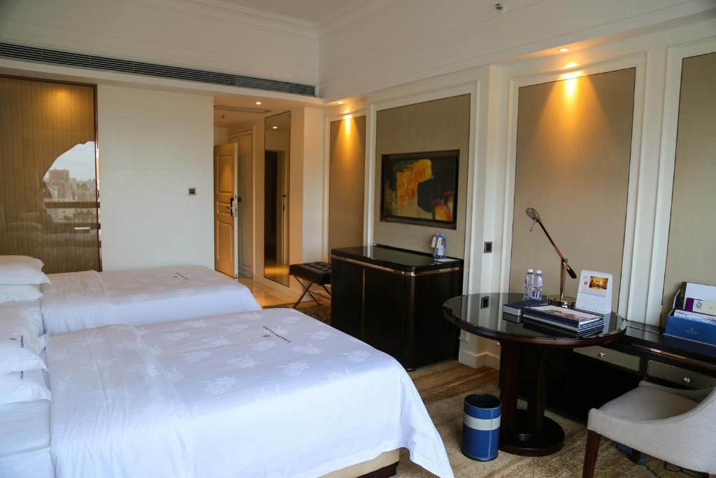 Postel nebo postele na pokoji v ubytování Shenzhen Dayhello international Hotel (Baoan)