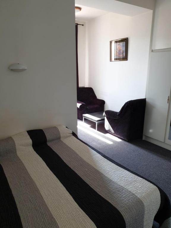 Postel nebo postele na pokoji v ubytování Hôtel Malpel