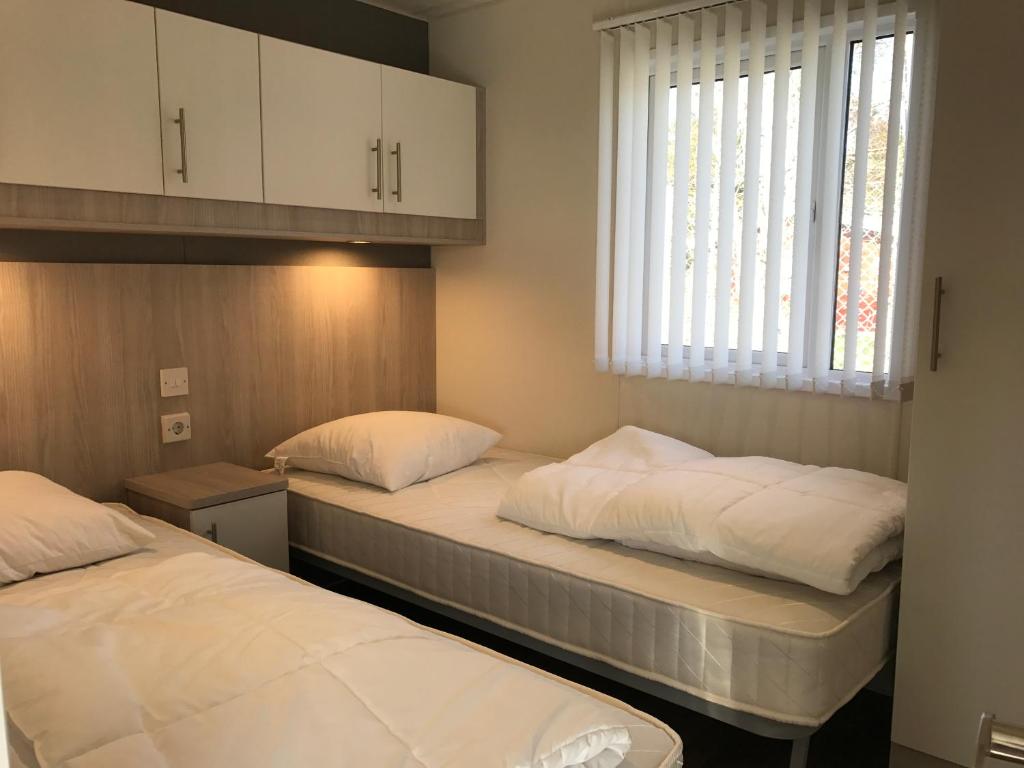 Postel nebo postele na pokoji v ubytování Tannisby Camping