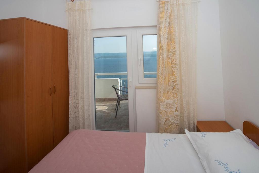 Postel nebo postele na pokoji v ubytování Apartments Drago Kovačić