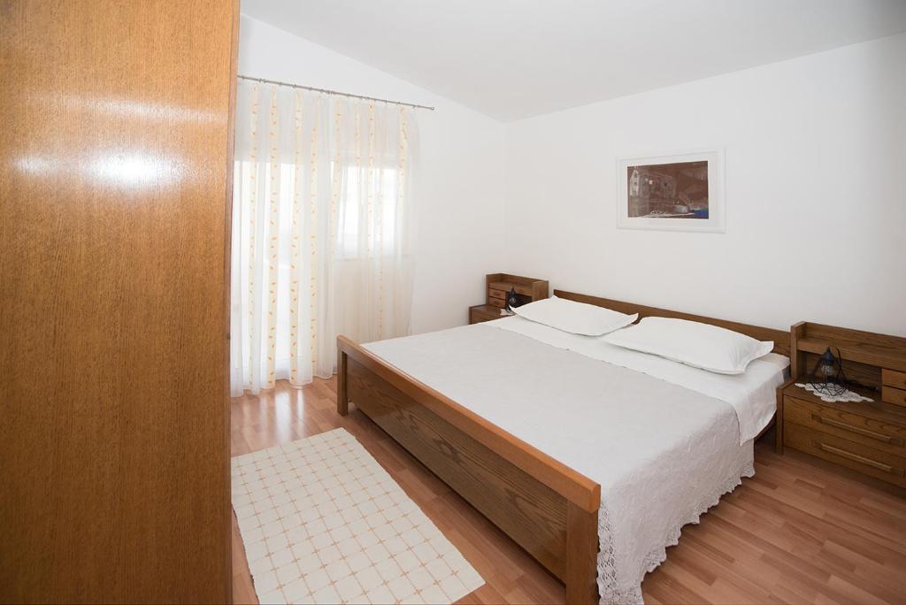 Postel nebo postele na pokoji v ubytování Apartments Drago Kovačić