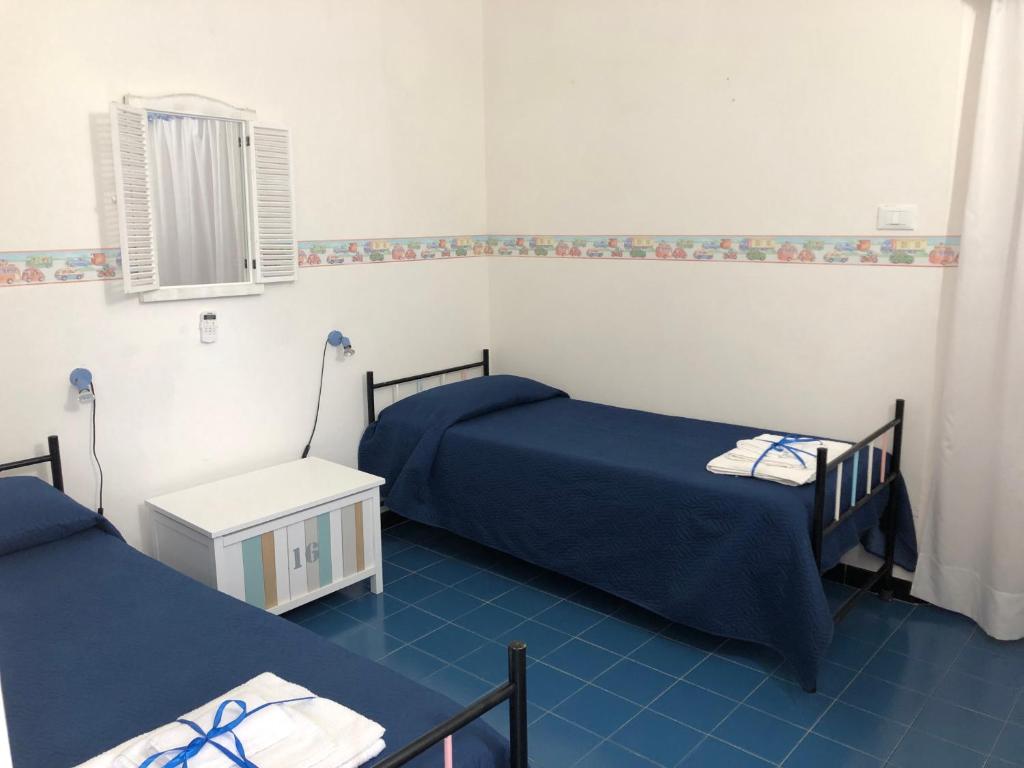 Postel nebo postele na pokoji v ubytování Villa Azzurra