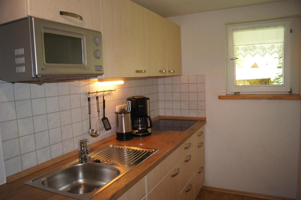 Kuchyň nebo kuchyňský kout v ubytování Gästehaus Nussbaumer