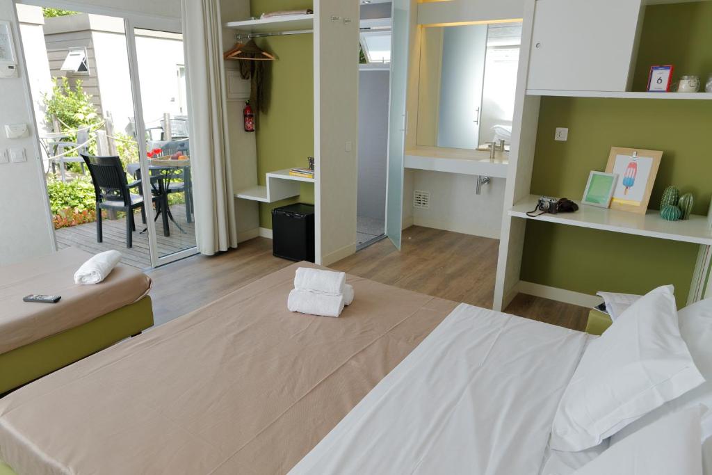 Postel nebo postele na pokoji v ubytování hu Roma Camping In Town