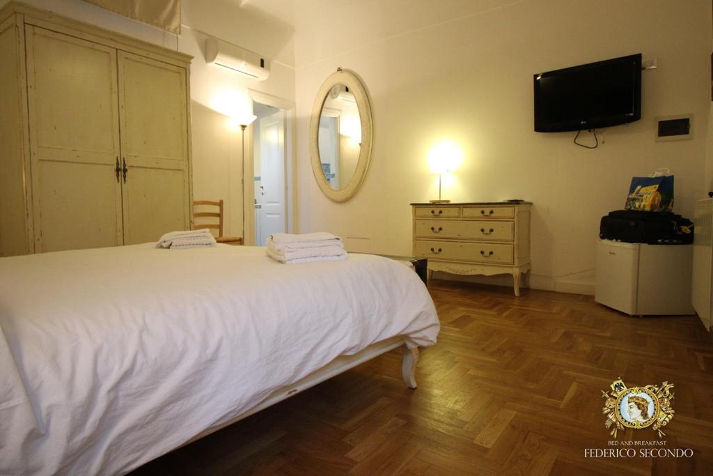 Posteľ alebo postele v izbe v ubytovaní Federico Secondo B&B