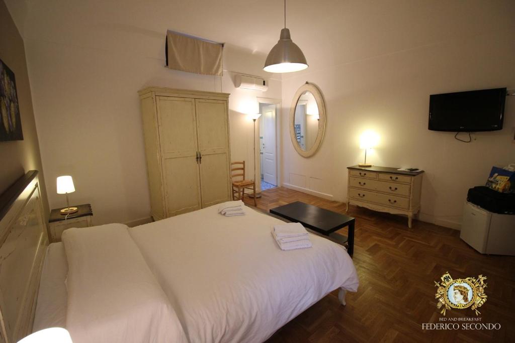 Posteľ alebo postele v izbe v ubytovaní Federico Secondo B&B