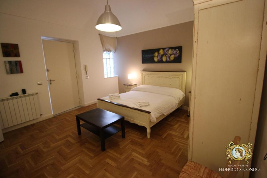 Posteľ alebo postele v izbe v ubytovaní Federico Secondo B&B