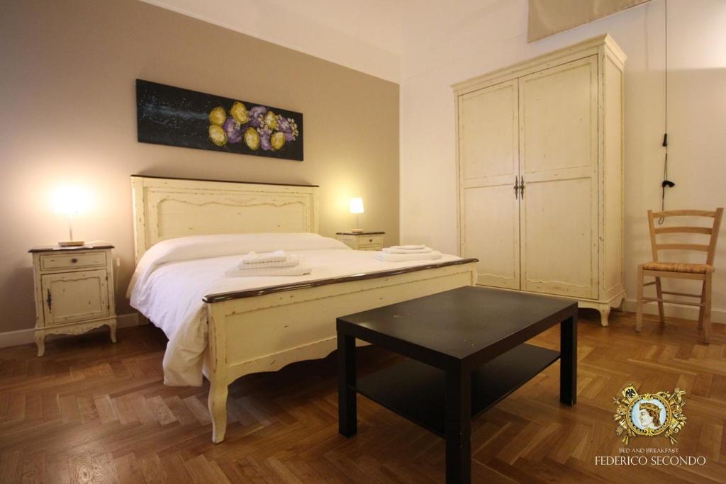 Posteľ alebo postele v izbe v ubytovaní Federico Secondo B&B