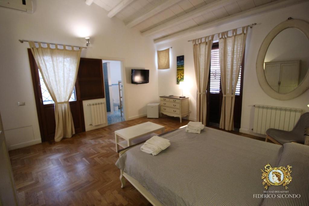 Posteľ alebo postele v izbe v ubytovaní Federico Secondo B&B