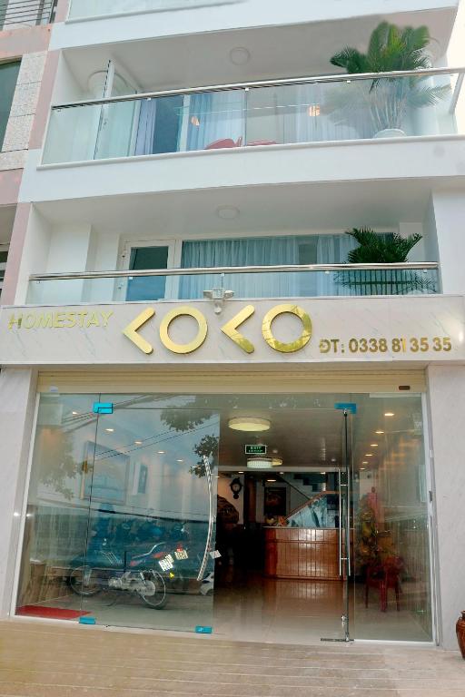 a store front of a building with a sign on it at Homestay coco in Vung Tau