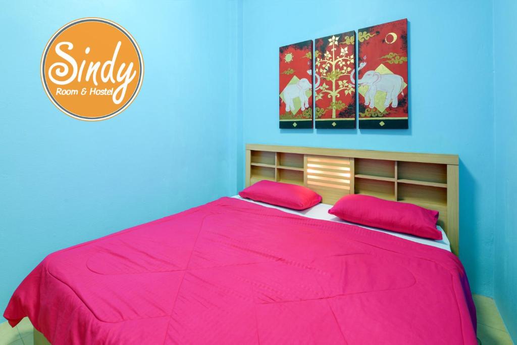 Postel nebo postele na pokoji v ubytování Sindy's Hostel