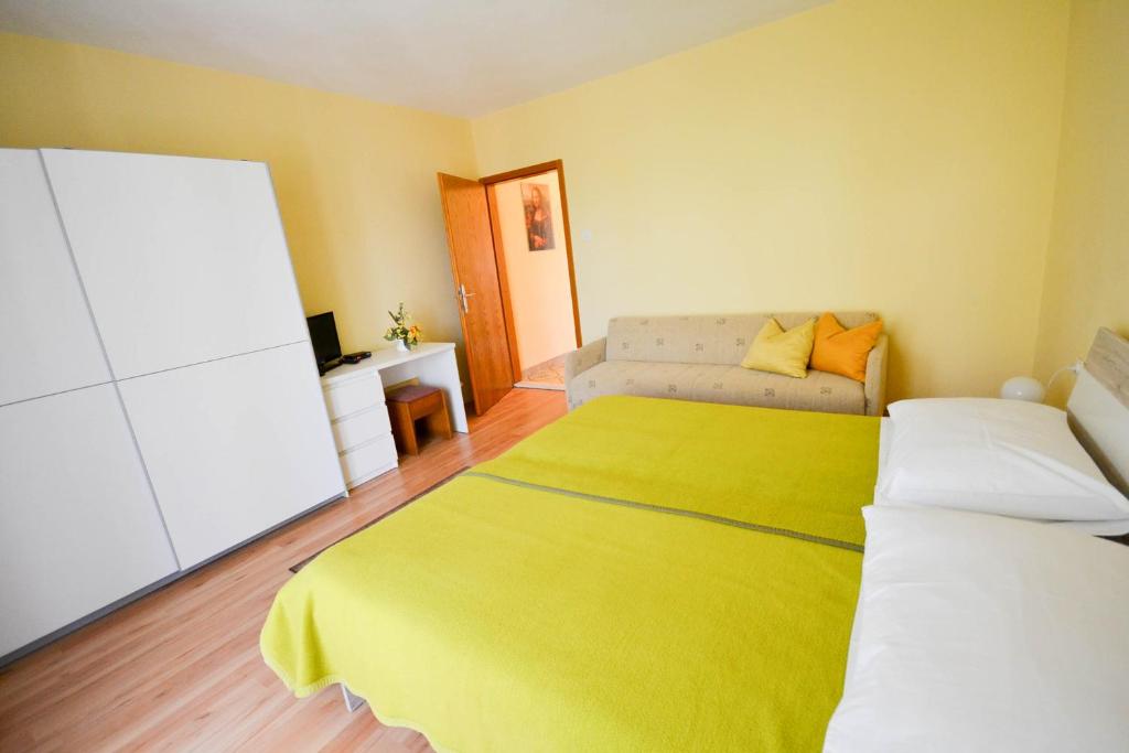 Postel nebo postele na pokoji v ubytování Jutta Apartment