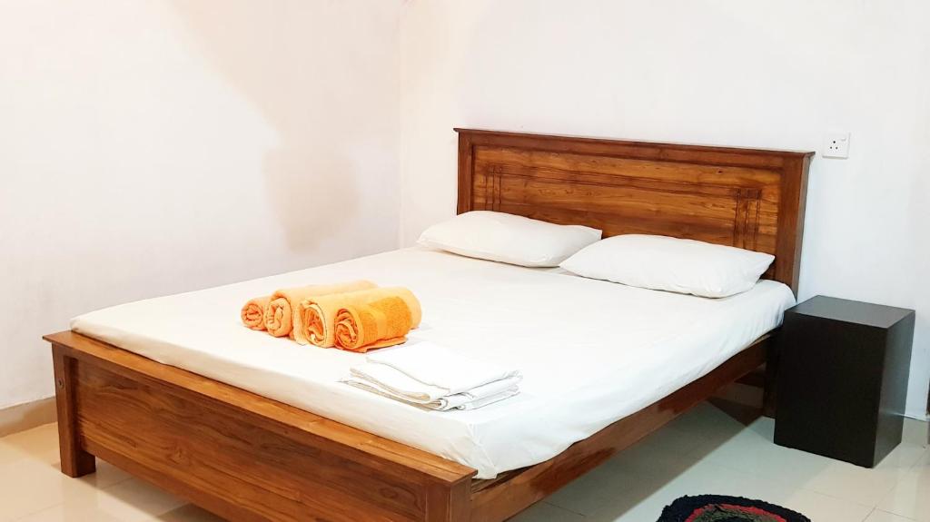 Postel nebo postele na pokoji v ubytování Nimal's Home