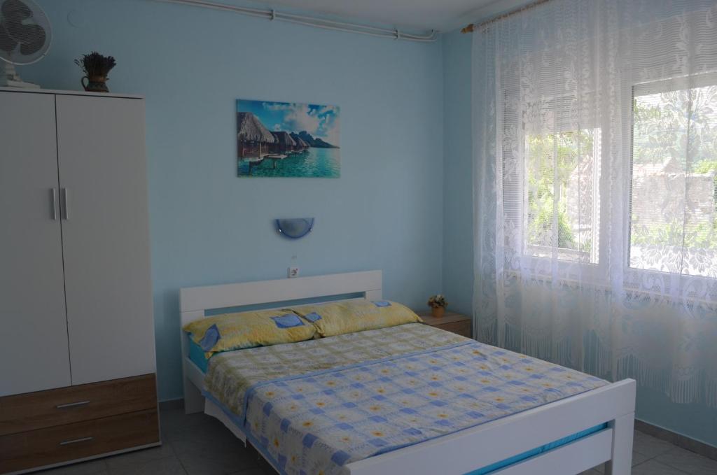 Postel nebo postele na pokoji v ubytování Apartments Alen