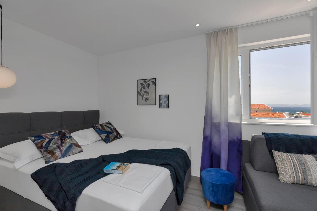 Postel nebo postele na pokoji v ubytování Apartments Strada Tučepi