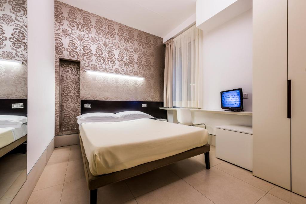 Postel nebo postele na pokoji v ubytování Savoy Hotel