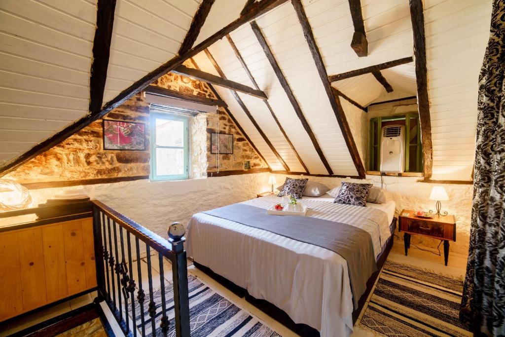 Кровать или кровати в номере Stone house Kala