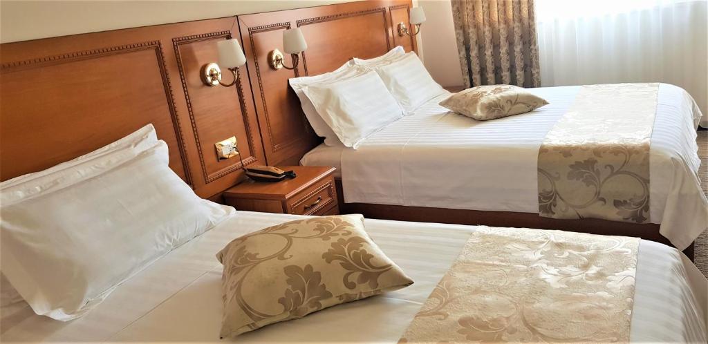 Postel nebo postele na pokoji v ubytování Hotel Boka