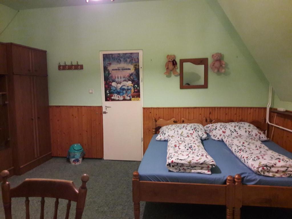 Postel nebo postele na pokoji v ubytování Triniti Vendégház