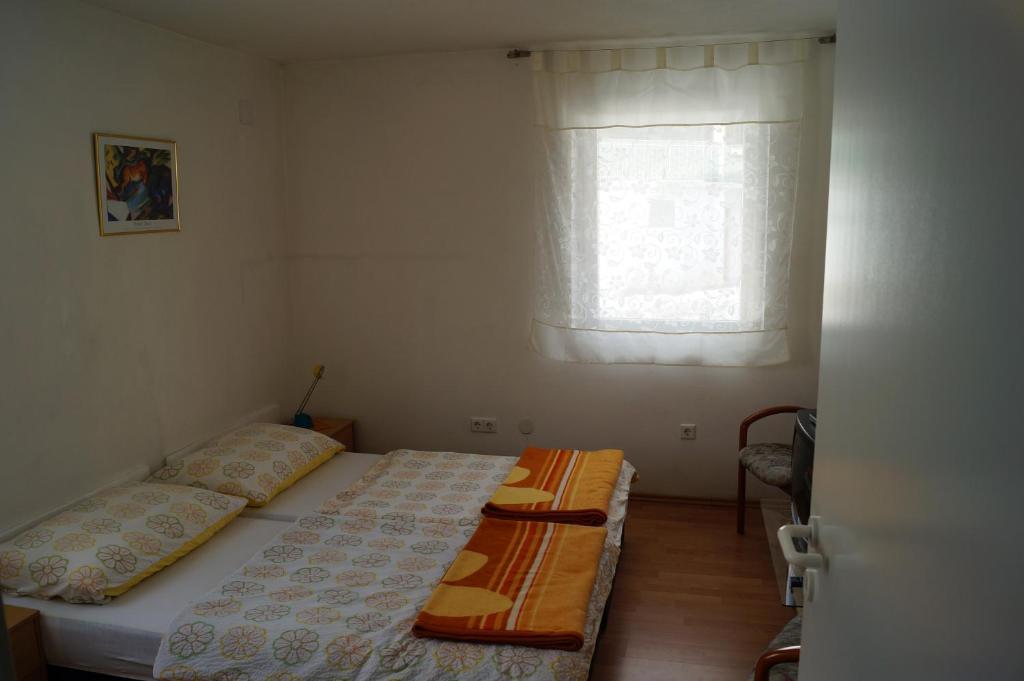 A bed or beds in a room at Apartments Krassnig