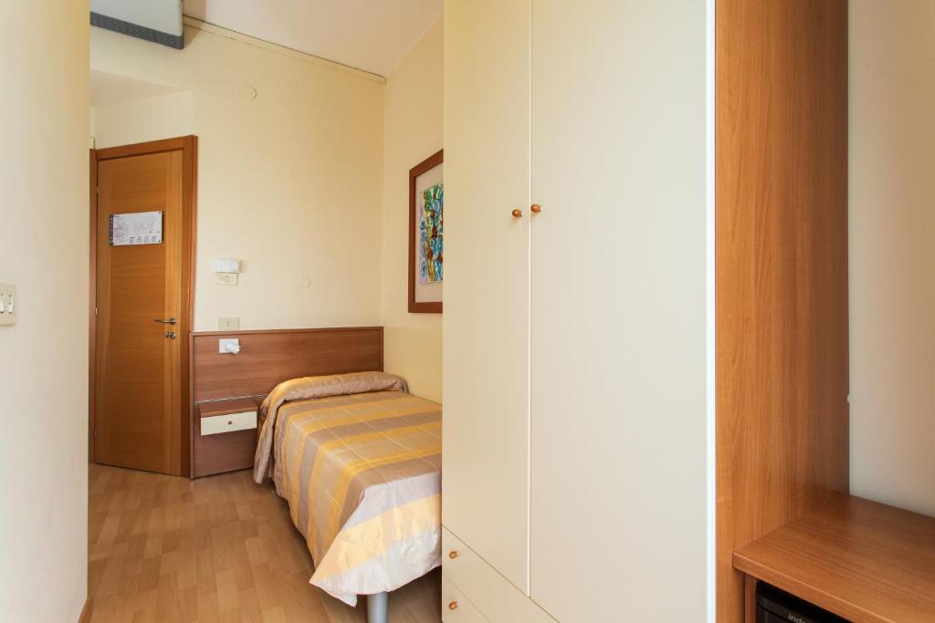 Postel nebo postele na pokoji v ubytování Hotel Ancora