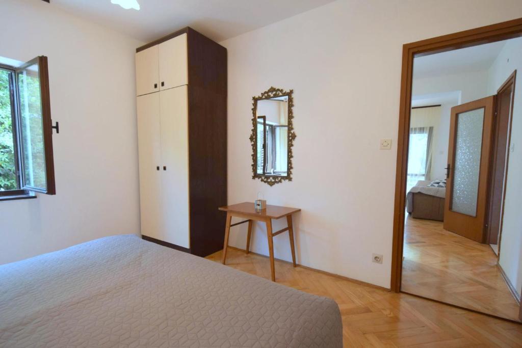 Łóżko lub łóżka w pokoju w obiekcie Apartments Jadanec