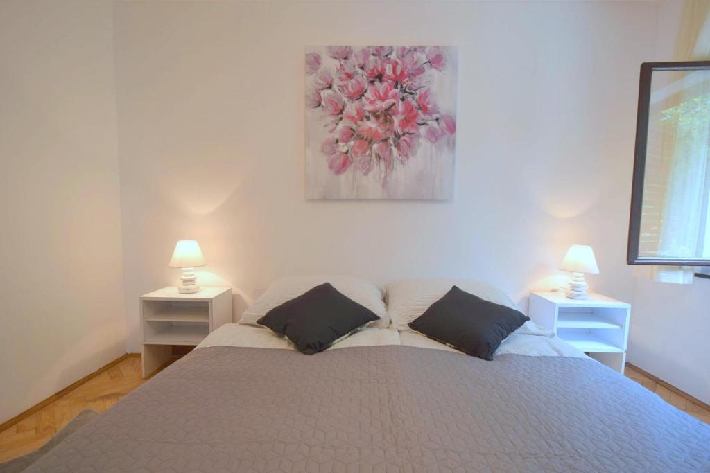 Łóżko lub łóżka w pokoju w obiekcie Apartments Jadanec