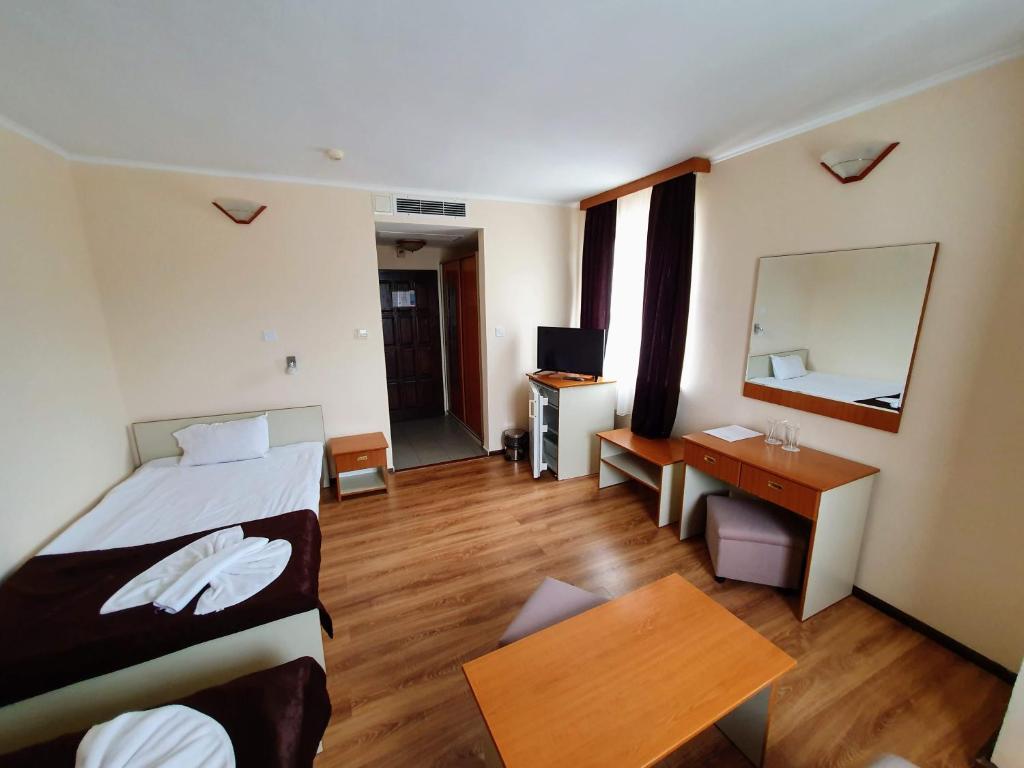 Postel nebo postele na pokoji v ubytování Hotel Sigma