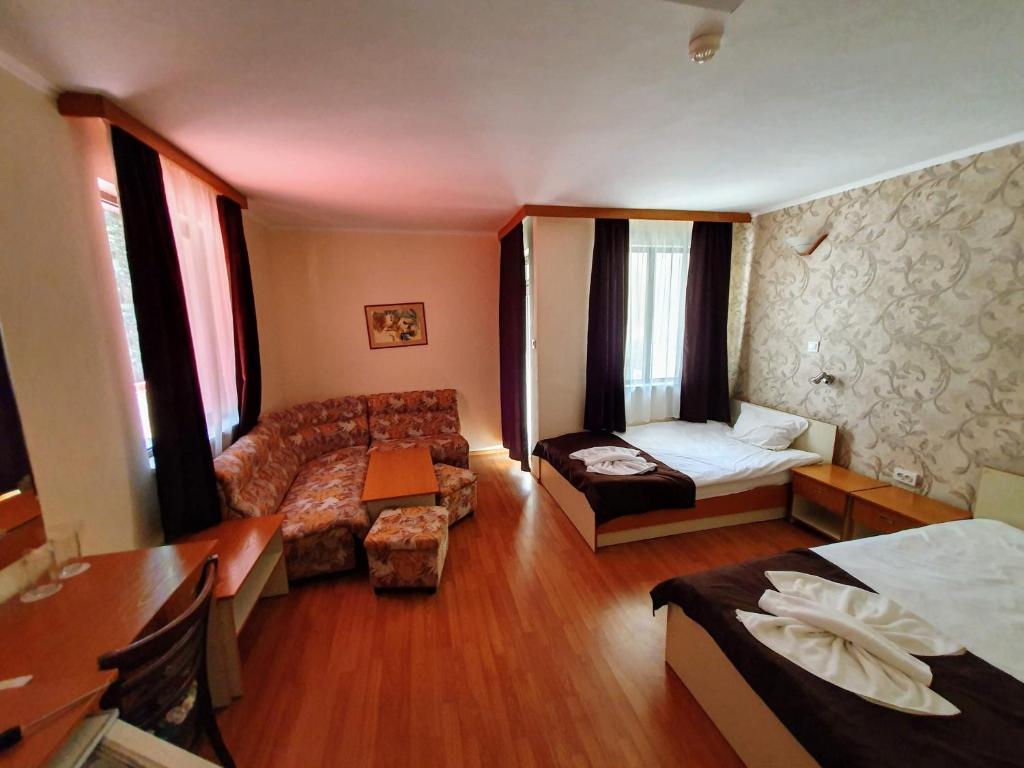 Postel nebo postele na pokoji v ubytování Hotel Sigma