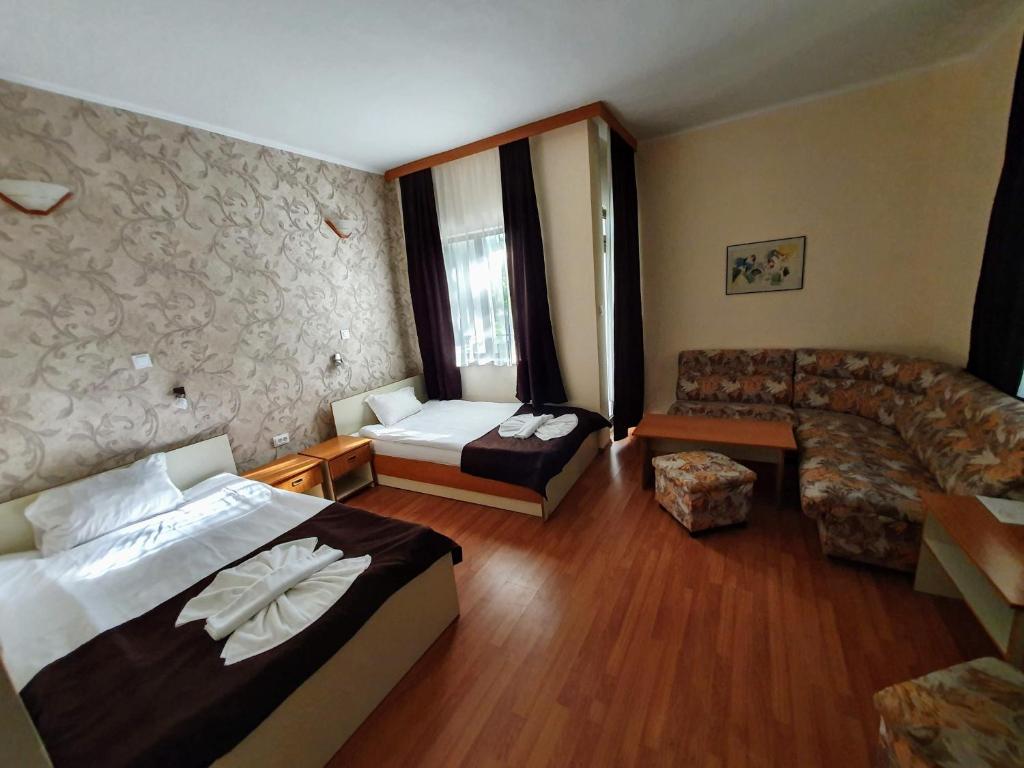 Postel nebo postele na pokoji v ubytování Hotel Sigma