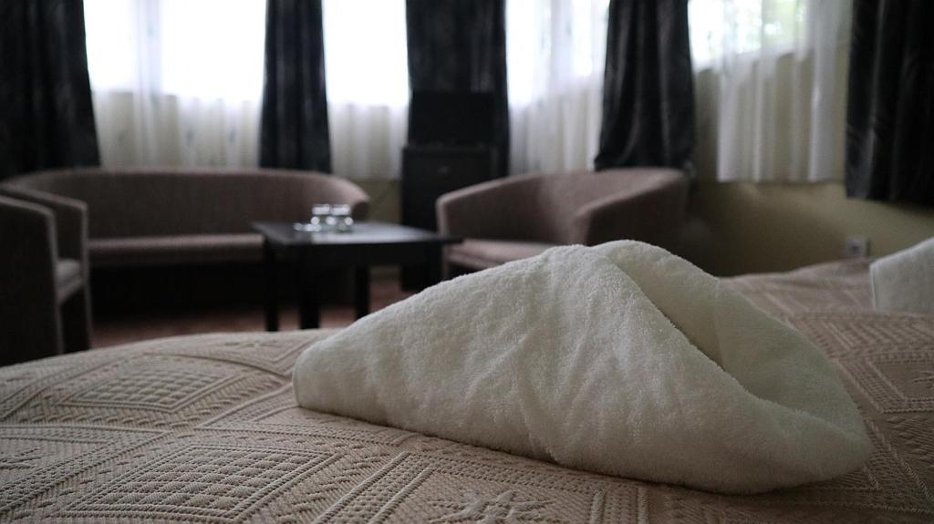 Łóżko lub łóżka w pokoju w obiekcie Szlovák Panzió