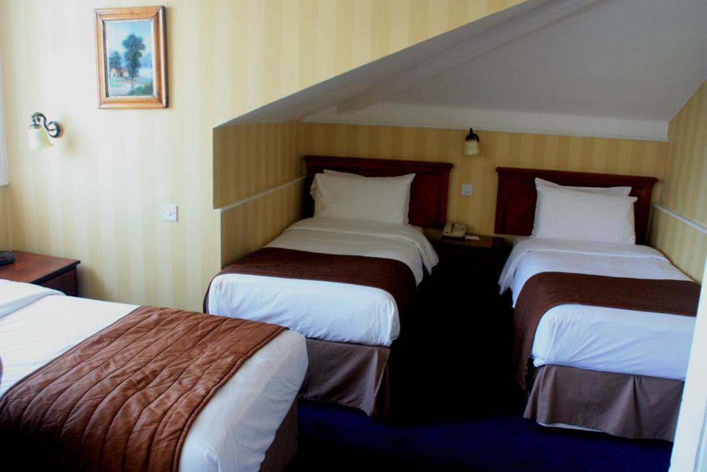 Postel nebo postele na pokoji v ubytování Best Western Swiss Cottage Hotel
