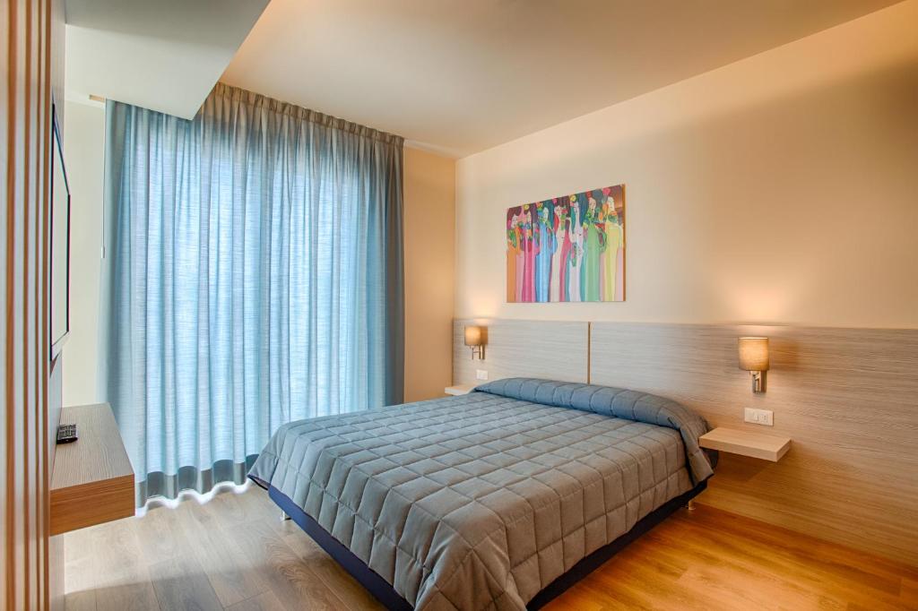 Postel nebo postele na pokoji v ubytování Hotel Ancora