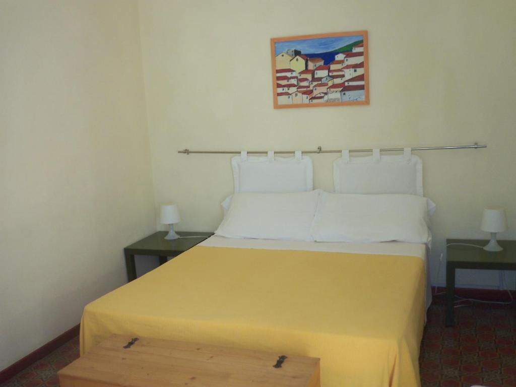 Posteľ alebo postele v izbe v ubytovaní B&B CARAVAGGIO SIRACUSA 200 Metres from Ortigia