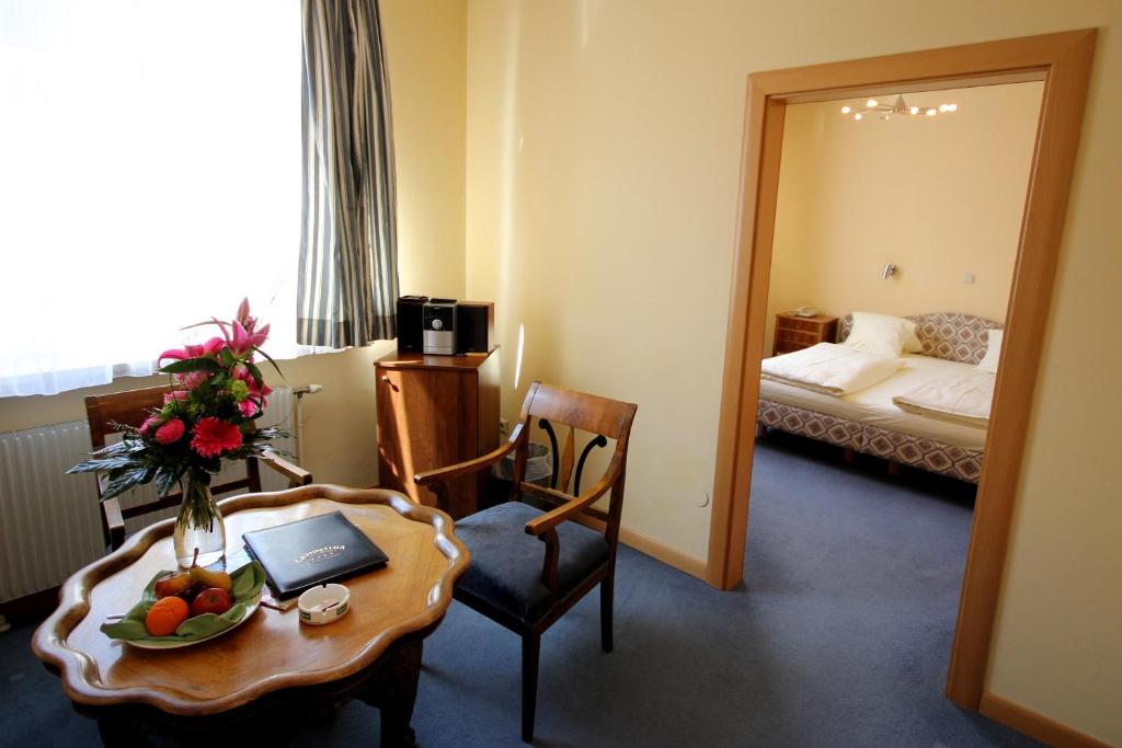 Posteľ alebo postele v izbe v ubytovaní Carinthia Stadthotel