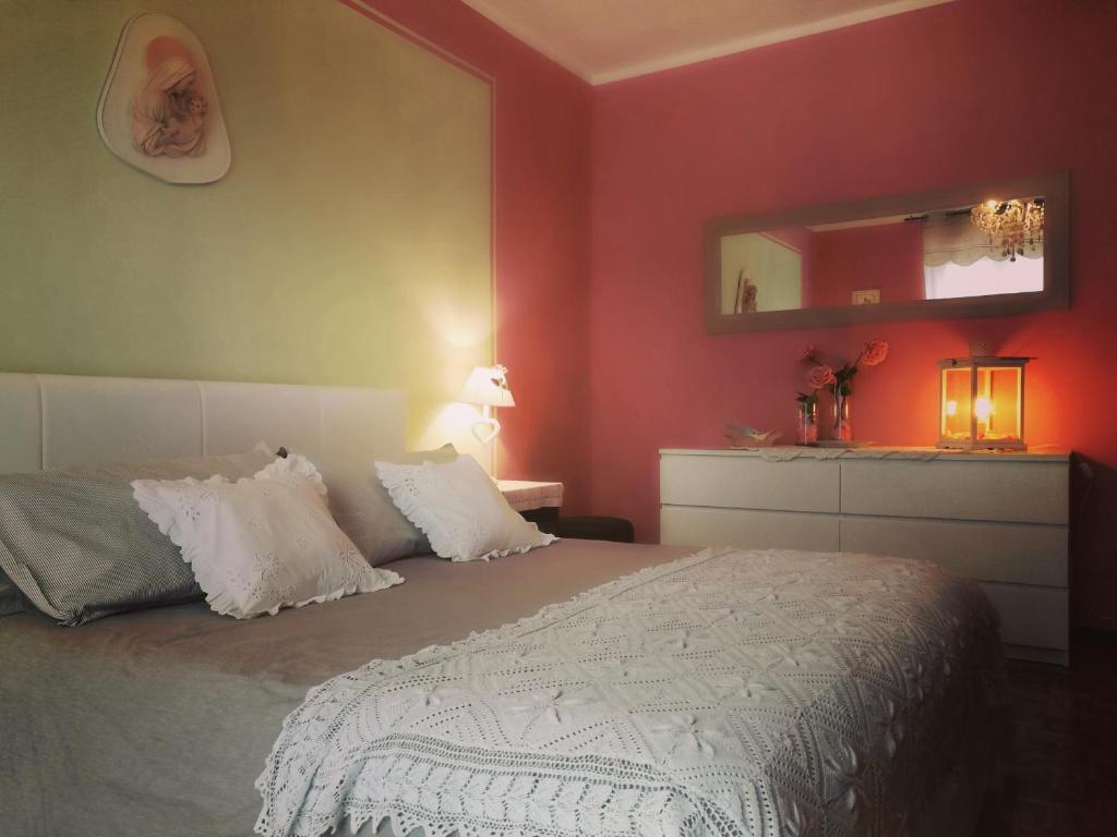 Postel nebo postele na pokoji v ubytování Le rose di Mapi