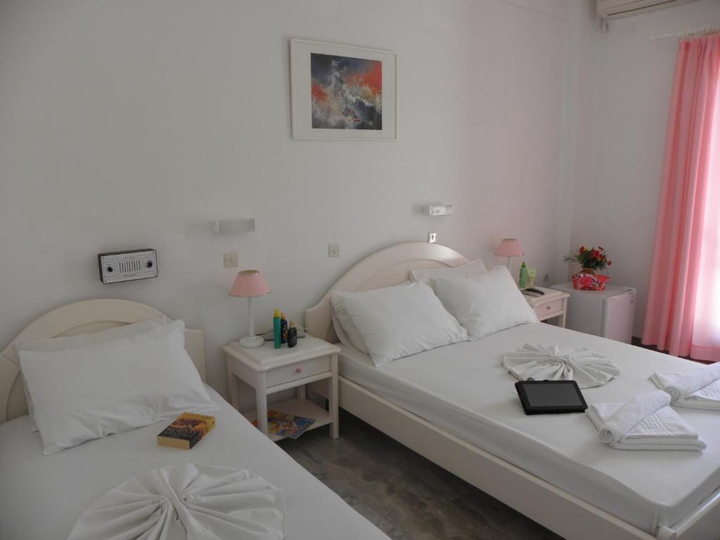 Postel nebo postele na pokoji v ubytování Areti Hotel