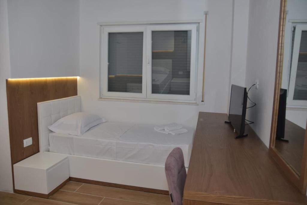 Postelja oz. postelje v sobi nastanitve Airen Hotel Velipoje