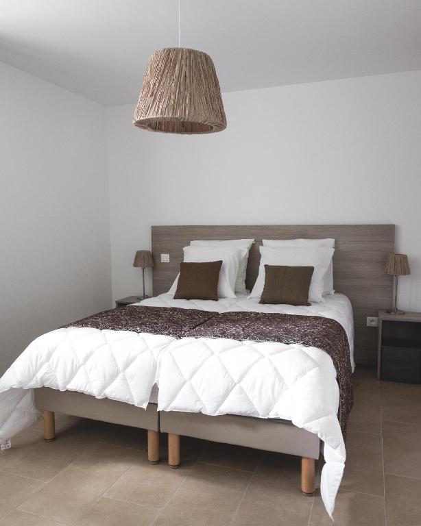 Postel nebo postele na pokoji v ubytování Au chalet des quatre saisons