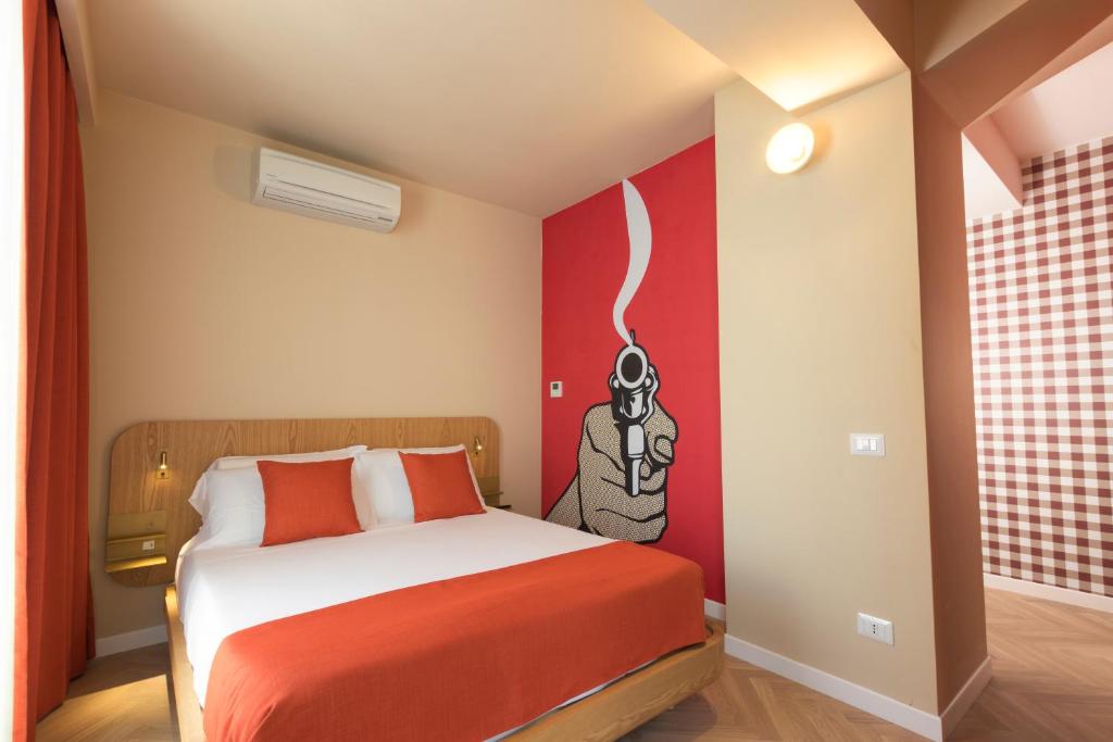 A bed or beds in a room at Metropolitan Suites