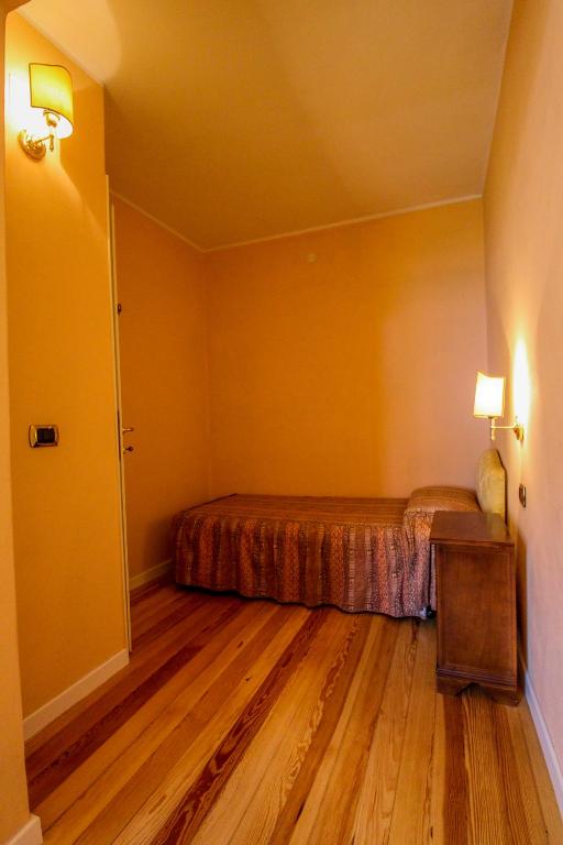 Postel nebo postele na pokoji v ubytování Hotel Moderno