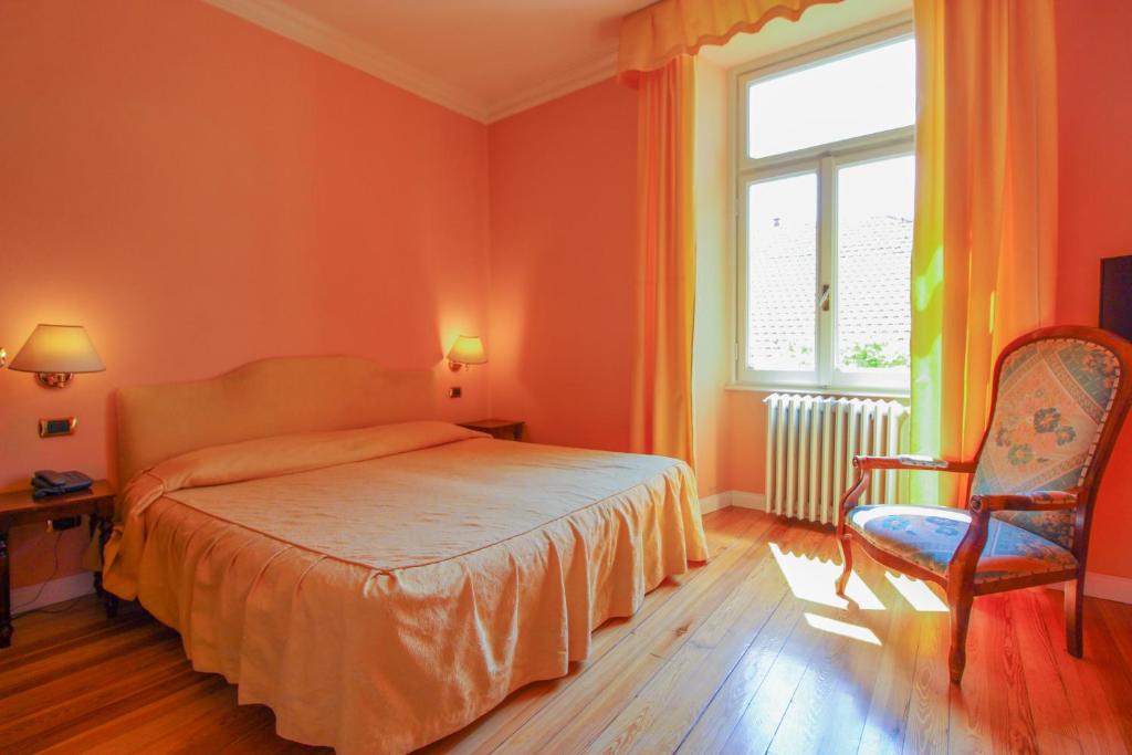 Postel nebo postele na pokoji v ubytování Hotel Moderno