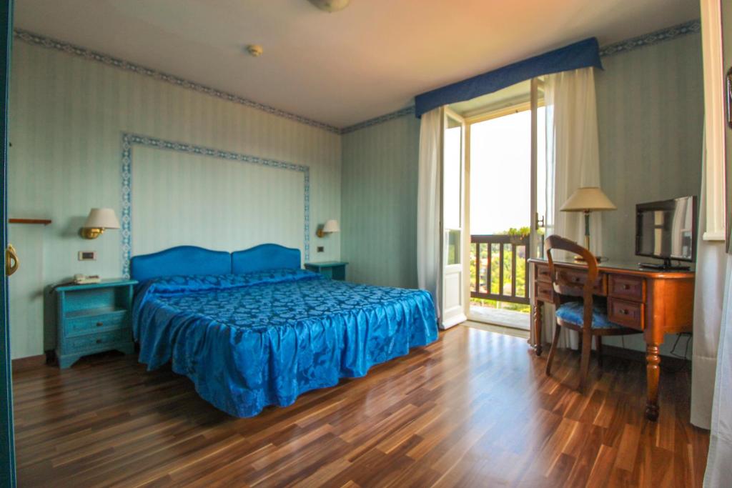 Postel nebo postele na pokoji v ubytování Hotel Moderno