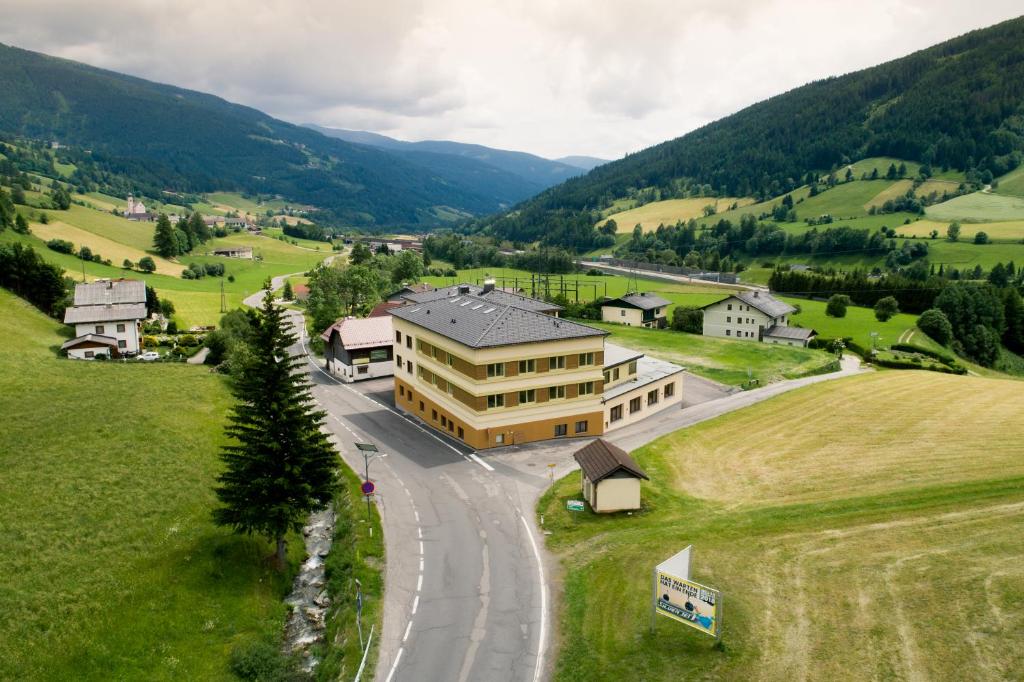 an aerial view of a building in the mountains at Mühlbacherhof in Rennweg