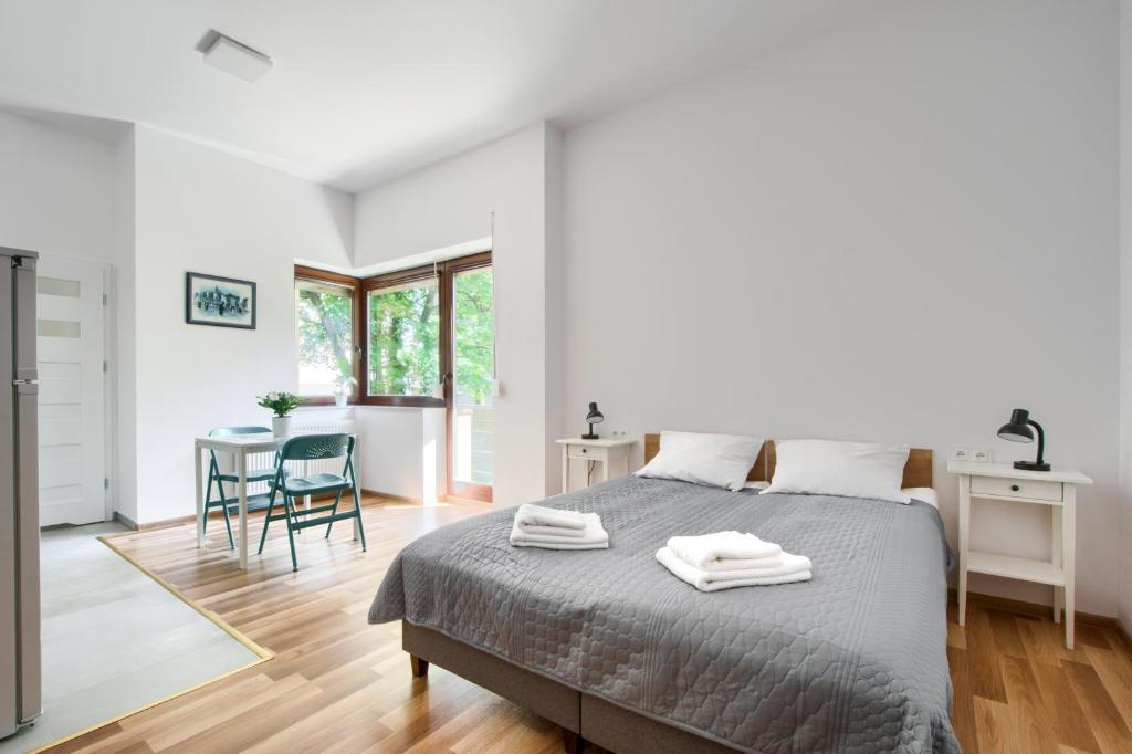 Posteľ alebo postele v izbe v ubytovaní Art Apartments