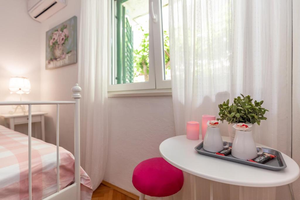 Postel nebo postele na pokoji v ubytování Apartmani Marko