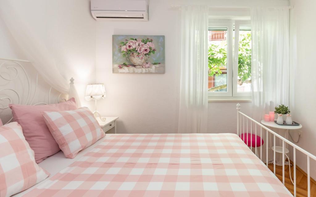Postel nebo postele na pokoji v ubytování Apartmani Marko
