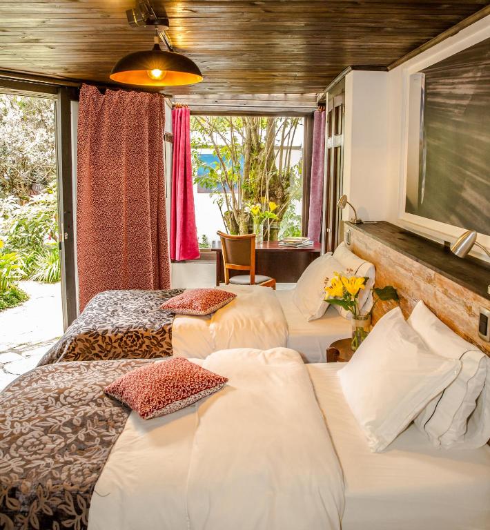 Postel nebo postele na pokoji v ubytování La Colina Hotel Cottage