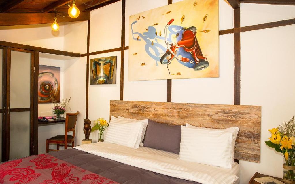 Postel nebo postele na pokoji v ubytování La Colina Hotel Cottage
