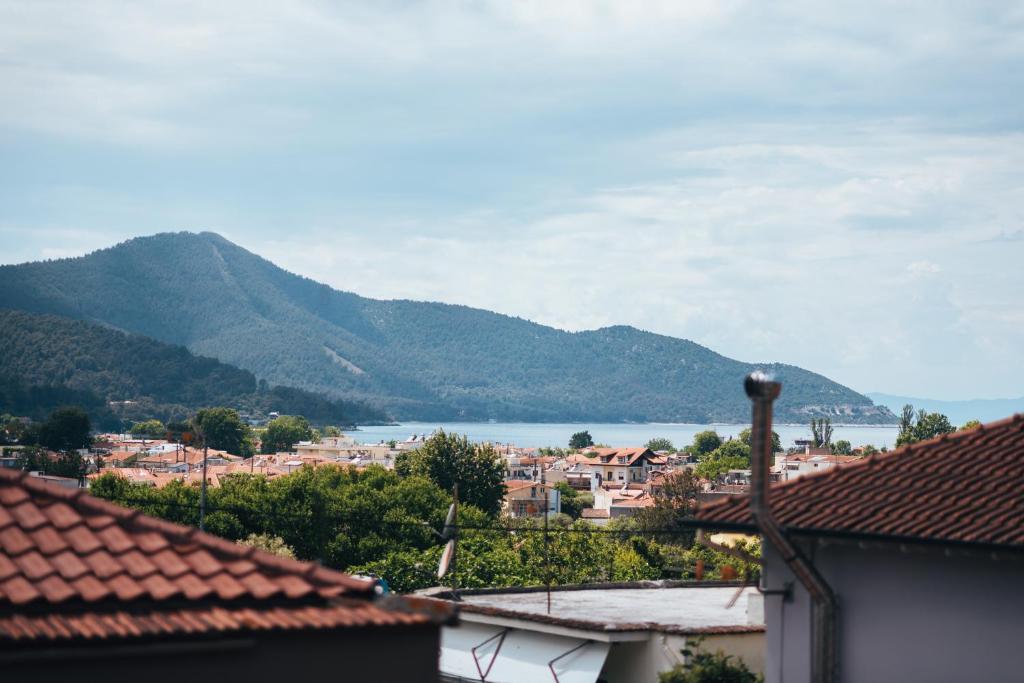 a view of a town with mountains and a lake at Roxanne’s Home in Limenas
